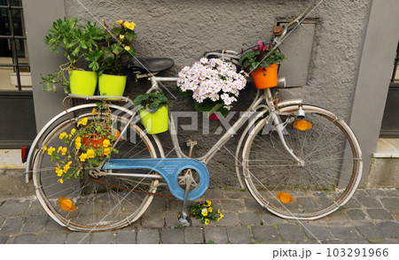 bicycle decorated with colorful flowers  103291966