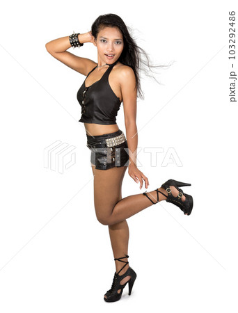 A attractive woman dressed in black leather A attractive woman dressed in black leather 103292486
