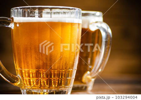 Fresh beer in glasses. 103294004