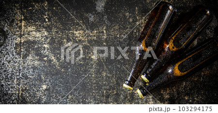 Fresh beer in closed bottles. 103294175