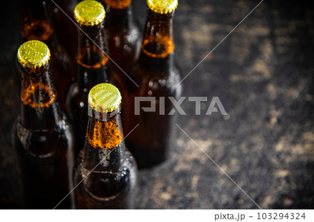 Fresh beer in closed bottles. Fresh beer in closed bottles. 103294324