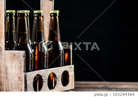 Beer bottles in an old box. Beer bottles in an old box. 103294364