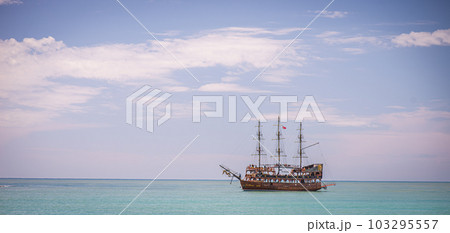 Pirate ship at the open sea at the sunset Pirate ship at the open sea at the sunset 103295557