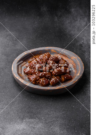 Chicken hearts fried in soy sauce with salt and spices in a plate 103296225