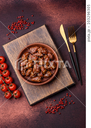 Chicken hearts fried in soy sauce with salt and spices in a plate 103296305