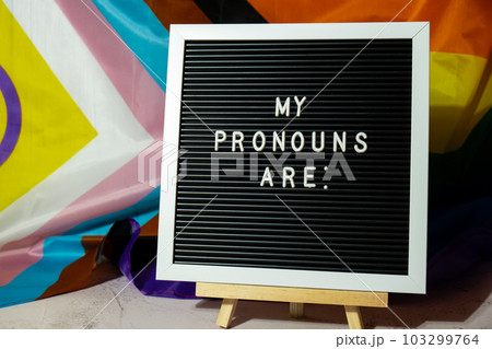 MY PRONOUNS ARE text Neo pronouns concept on Rainbow flag background gender pronouns. Non-binary people rights transgenders. Lgbtq community support assume my gender tolerance equal rights 103299764
