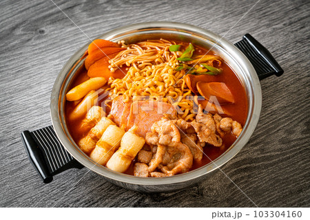 Budae Jjigae or Budaejjigae (Army stew or Army base stew). It is loaded with Kimchi, spam, sausages, ramen noodles and much more 103304160