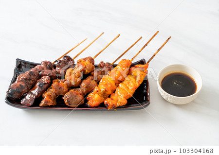 Japanese chicken grill or yakitori serve in izakaya style Japanese chicken grill or yakitori serve in izakaya style 103304168