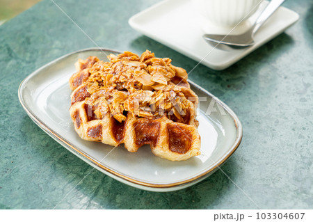 Croffles with almond and caramel - Food Trend that compound word from Croissant and Waffle 103304607