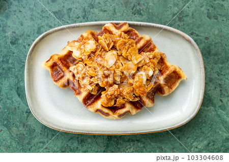 Croffles with almond and caramel - Food Trend that compound word from Croissant and Waffle 103304608