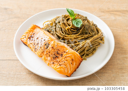 pesto spaghetti pasta with grilled salmon pesto spaghetti pasta with grilled salmon 103305458