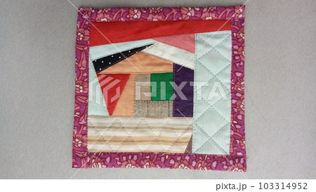 Colorful handmade textiles. Colored fabric patchwork background. Patchwork background. Multicolored patchwork knitted background. 103314952