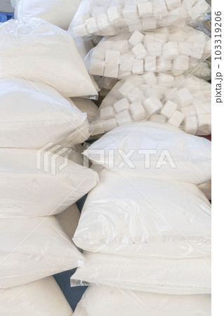 cube and granulated sugar in transparent bags at market cube and granulated sugar in transparent bags at market 103319206