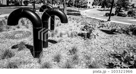 Underground structure manhole ventilation pipe in the shape of a candy cane. 103321966