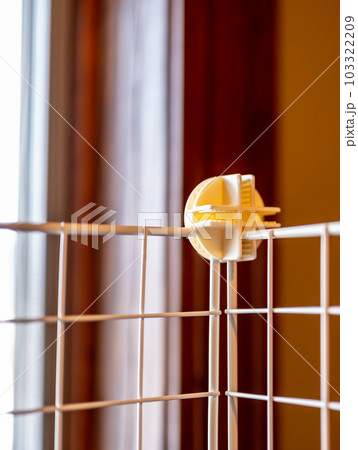 Selective focus on a connecting block on a modular wire cage shelving system Selective focus on a connecting block on a modular wire cage shelving system 103322209