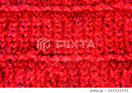 Handmade knitted fabric red wool background texture Handmade knitted fabric red wool background texture 103322541