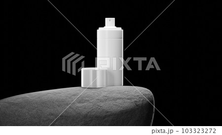 Bottle with sprey on big grey stone. 103323272