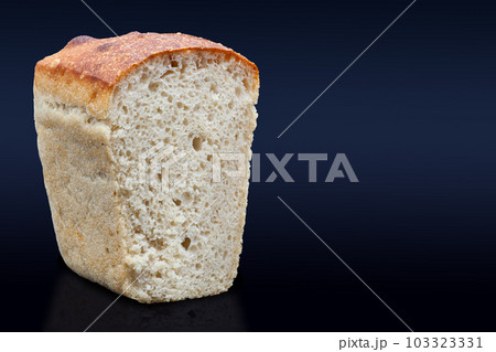 Rye bread on sourdough on a dark background in the section. Rye bread on sourdough on a dark background in the section. 103323331