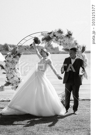 wedding ceremony of the newlyweds on the pier 103325377