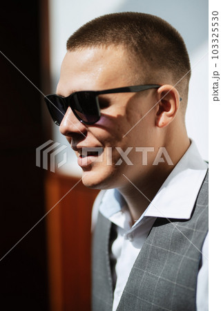 portrait of the groom of a man in the morning before the wedding portrait of the groom of a man in the morning before the wedding 103325530