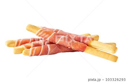 grissini or breadsticks with parma ham prosciutto isolated on white background. breadsticks with prosciutto isolated . grissini or breadsticks with parma ham prosciutto isolated on white background. breadsticks with prosciutto isolated . 103326293