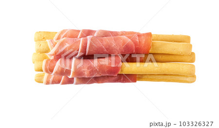 Parma ham prosciutto with Italian grissini breadsticks isolated on white background. Parma ham prosciutto with Italian grissini breadsticks isolated on white background. 103326327
