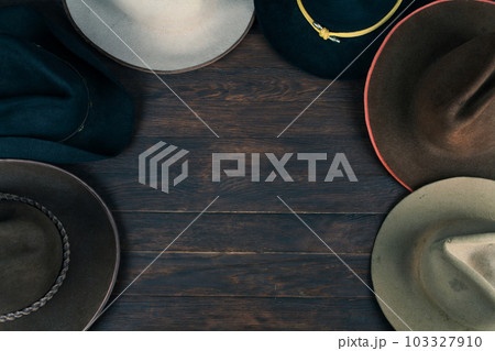 Old west hats on table. Top view. Old west hats on table. Top view. 103327910