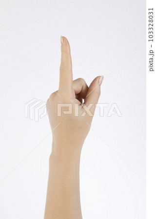 Female hand with raised index finger up on a white background. 103328031
