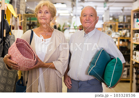 Mature family couple shopping at household store Mature family couple shopping at household store 103328536