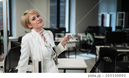 Business woman sitting at the desktop in the office. Business woman sitting at the desktop in the office. 103330093