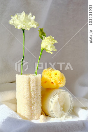 Scrub, loofah washcloth and organic sea sponge on the towel. 103331955