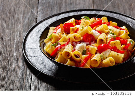 pepper tomato mozzarella pasta salad in bowl pepper tomato mozzarella pasta salad in bowl 103335215