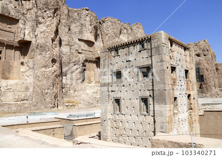 Royal tombs and Cube of Zoroaster (Ka'ba-ye Zartosht ) in ancient necropolis Naqsh-e Rustam, Achaemenid dynasty, Fars province, Iran. UNESCO world heritage site 103340271