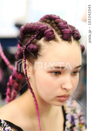 girl with brown hair and pigtails braided with artificial hair braiding girl with brown hair and pigtails braided with artificial hair braiding 103342045