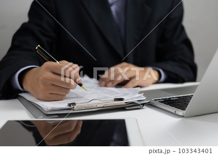 businessman hold pen signing or signature contract law paper.Employee writing agreement document job application. 103343401