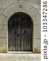 old wooden door in wall 103347286
