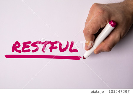 Restful. Text, a man's hand holding a marker on a white background 103347397