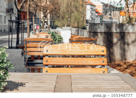 Center of the city, spring time, chairs near the cafe 103348777