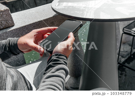 Portrait of a hipster man. A man in a big city with smartphone, a life style concept	 103348779