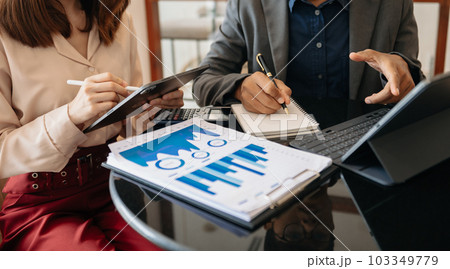 Business team meeting. professional investor working new start up project. Finance task. with smart phone and laptop and digital tablet computer 103349779
