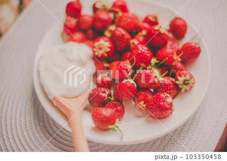 Bunch of bananas and strawberries. Photo toned style Instagram filters. Concept of healthy breakfast. Flatlay 103350458