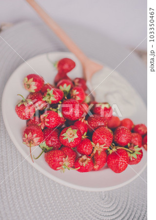 Bunch of bananas and strawberries. Photo toned style Instagram filters. Concept of healthy breakfast. Flatlay 103350467