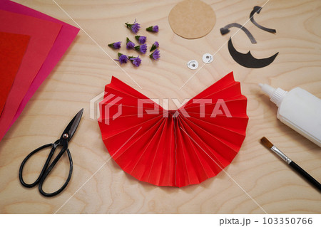 Step by step diy process handmade craft Ladybug made of paper and flowers. Step 4- glue the two ends of the accordion to make a semicircle. Red love symbol. 103350766