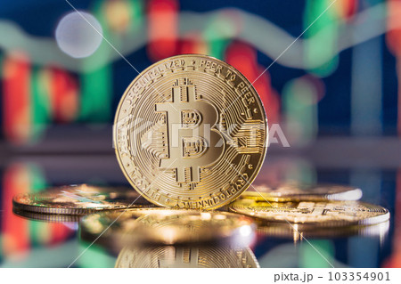 Golden shine bitcoins on candlesticks chart background 103354901