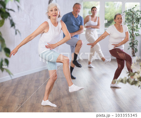 Mature woman with visitor actively moves and learns to dance hip hop Mature woman with visitor actively moves and learns to dance hip hop 103355345