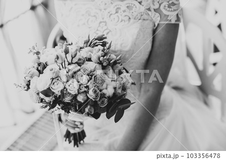 Portrait of stunning bride with long hair posing with great bouquet Portrait of stunning bride with long hair posing with great bouquet 103356478