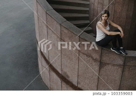 Portrait of young sporty parkour woman. Freeruning female 103359003