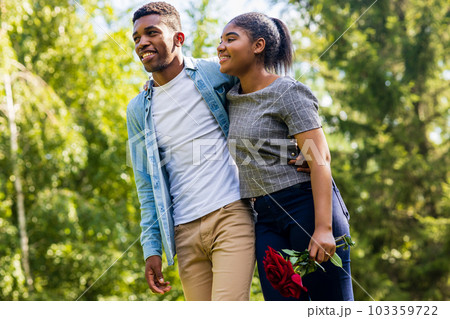 Smiling african couple at romantic picnic in summer park dation at sunny day 103359722