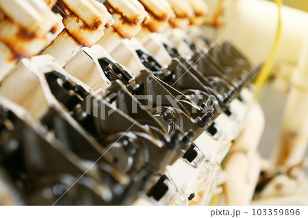 model of a vehicle engine, engine exhaust valve and intake valve, spring valve of the engine and auto spare parts, machine parts damaged from work. 103359896