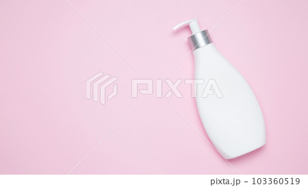 Cosmetic beauty products on pink background. Bottles with Pump Dispenser branding mock up. Skin care and beauty concept. Top view, flat lay, copy space, banner Cosmetic beauty products on pink background. Bottles with Pump Dispenser branding mock up. Skin care and beauty concept. Top view, flat lay, copy space, banner 103360519